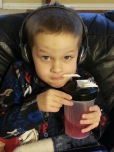 Colin was home sick one day.  Took a pic of him sitting with his tablet, kleenex, and gatorade.  He saw the picture and had to pose. 